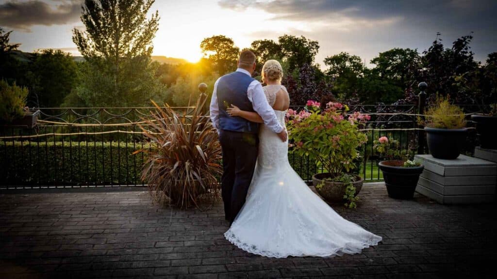 Couple watching the sunset at the Veranda